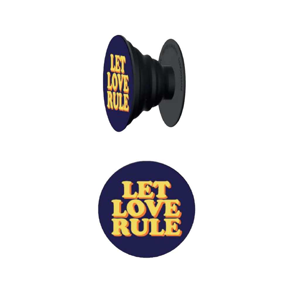 Pop-style phone grip with bold yellow "LET LOVE RULE" text on a dark navy background.